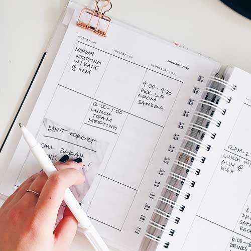 Customer checking her diary for free time